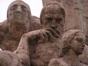 Faces of the statue in the center of TrujilloÂ´s main plaza.